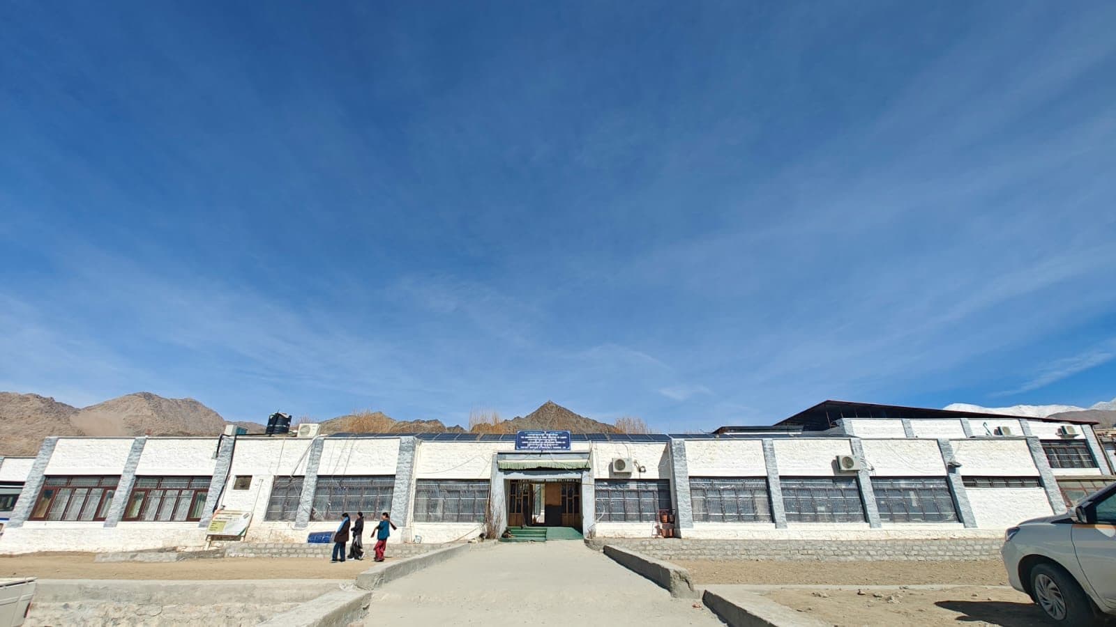 DIET Leh campus building with solar panels under a clear Ladakh sky
