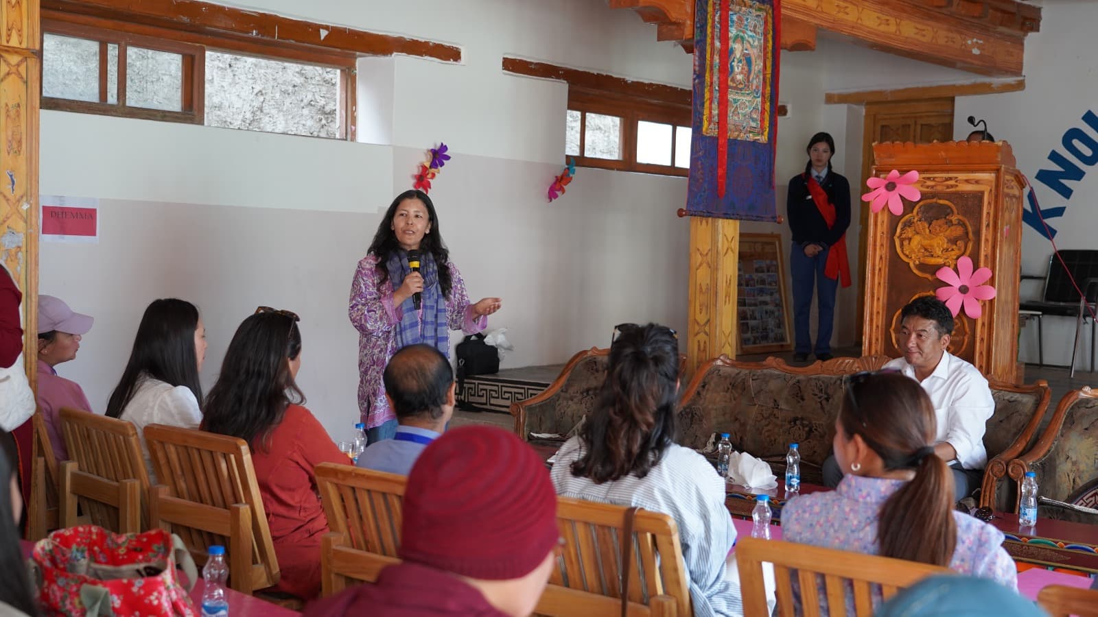A resource person addressing teachers with a microphone during a DIET Leh digital-technology workshop