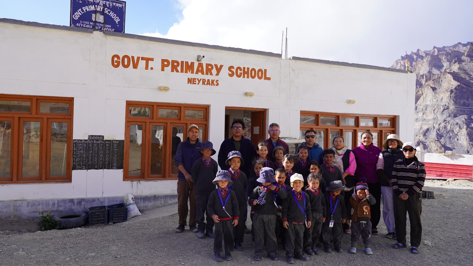 The monitoring team with students and staff outside Govt. Primary School, Neyraks