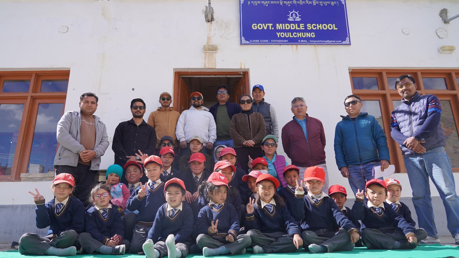 The monitoring team with students and staff outside Govt. Middle School, Youlchung